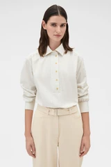 Profile view of model wearing the Oroton Soft Check Button Shirt in Cream and 100% cotton fabric for Women .