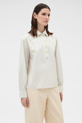Profile view of model wearing the Oroton Soft Check Button Shirt in Cream and 100% cotton fabric for Women .