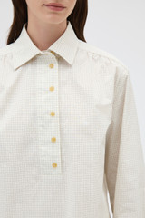 Profile view of model wearing the Oroton Soft Check Button Shirt in Cream and 100% cotton fabric for Women .