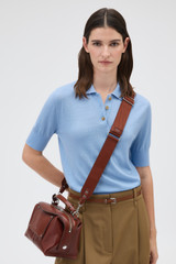 Profile view of model wearing the Oroton Mica Burnished Leather Bag Strap in Dark Chestnut and Premium smooth, vegetable-tanned leather for Women .