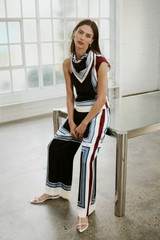 Profile view of model wearing the Oroton Silk Scarf One Shoulder Top in Black and 100% silk twill fabric for Women .