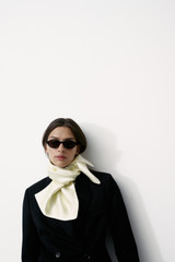 Profile view of model wearing the Oroton Shaped Double Breasted Blazer in Black and 100% wool fabric for Women .