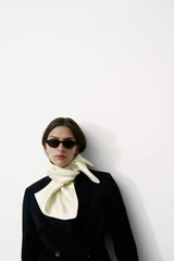Profile view of model wearing the Oroton Shaped Double Breasted Blazer in Black and 100% wool fabric for Women .