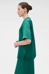 Profile view of model wearing the Oroton Double Satin Tee in Neptune Green and 100% viscose fabric for Women .