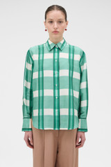 Profile view of model wearing the Oroton Ombre Check Silk Shirt in Neptune Green and 100% SILK DUPION for Women .