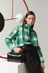 Profile view of model wearing the Oroton Ombre Check Silk Shirt in Neptune Green and 100% SILK DUPION for Women .