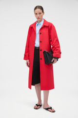Profile view of model wearing the Oroton Essential Mac in Poppy and 100% cotton fabric for Women .