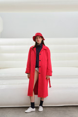 Profile view of model wearing the Oroton Essential Mac in Poppy and 100% cotton fabric for Women .