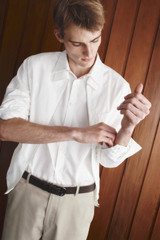 Profile view of model wearing the Oroton Otto Smooth 35MM Belt in Dark Chocolate and Premium smooth cow leather for Men .