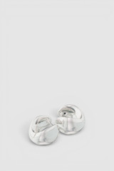 Detail product shot of the Oroton Banks Huggie in Bright Silver and Premium brass material for Women .