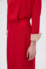 Profile view of model wearing the Oroton Two Tone Crepe Dress in Rich Red and 96% viscose and 4% spandex blend fabric for Women .