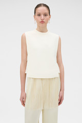 Profile view of model wearing the Oroton Fringe Detail Top in Soft Cream and 96% viscose and 4% spandex blend fabric for Women .