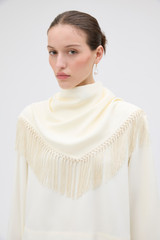Profile view of model wearing the Oroton Scarf Detail Top in Soft Cream and 96% viscose and 4% spandex blend fabric for Women .