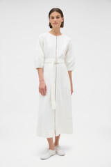 Profile view of model wearing the Oroton Zip Through Dress in Antique White and 100% cotton fabric for Women .