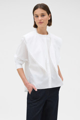 Profile view of model wearing the Oroton Lace Trim Cape Blouse in Antique White and 62% cotton and 38% linen blend fabric for Women .