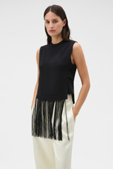 Profile view of model wearing the Oroton Fringe Detail Top in Black and 96% viscose and 4% spandex blend fabric for Women .