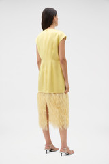 Profile view of model wearing the Oroton Feather Jacquard Sheath Dress in Butter and 100% polyester fabric for Women .
