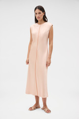 Profile view of model wearing the Oroton Double Satin Sheath Dress in Peach and 100% viscose fabric for Women .