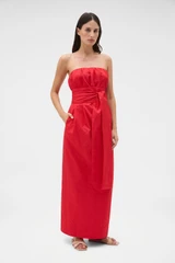 Profile view of model wearing the Oroton Tuck Detail Gown in Poppy and 85% polyester and 15% silk Mikado fabric for Women .