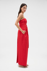 Profile view of model wearing the Oroton Tuck Detail Gown in Poppy and 85% polyester and 15% silk Mikado fabric for Women .