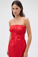 Profile view of model wearing the Oroton Tuck Detail Gown in Poppy and 85% polyester and 15% silk Mikado fabric for Women .