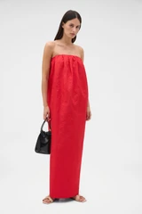 Profile view of model wearing the Oroton Tuck Detail Gown in Poppy and 85% polyester and 15% silk Mikado fabric for Women .
