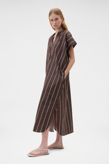 Profile view of model wearing the Oroton Stripe Detail Dress in Milk Chocolate and 100% cotton fabric for Women .