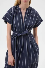 Profile view of model wearing the Oroton Stripe Detail Dress in Denim Blue and 100% cotton fabric for Women .