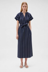 Profile view of model wearing the Oroton Stripe Detail Dress in Denim Blue and 100% cotton fabric for Women .