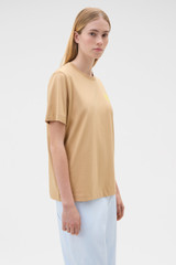 Profile view of model wearing the Oroton Maggie Graphic Tee in Praline and 100% cotton single jersey fabric for Women .
