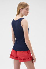 Profile view of model wearing the Oroton Scoop Neck Tank in North Sea and 92% cotton and 8% spandex blend fabric for Women .