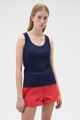 Profile view of model wearing the Oroton Scoop Neck Tank in North Sea and 92% cotton and 8% spandex blend fabric for Women .