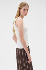 Profile view of model wearing the Oroton Scoop Neck Tank in Antique White and 92% cotton and 8% spandex blend fabric for Women .