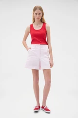 Profile view of model wearing the Oroton Flat Front Carpenter Short in Perfect Pink and 100% cotton fabric for Women .