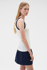 Profile view of model wearing the Oroton Contrast Bind Tank in Antique White and 92% cotton and 8% spandex blend fabric for Women .