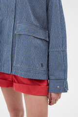 Profile view of model wearing the Oroton Washed Weekend Stripe Parka in Dark Navy and 100% cotton fabric for Women .