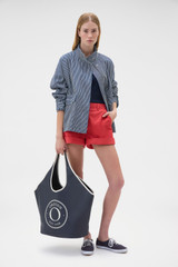 Profile view of model wearing the Oroton Washed Weekend Stripe Parka in Dark Navy and 100% cotton fabric for Women .