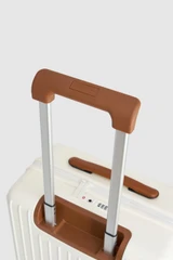 Detail product shot of the Oroton Jet Carry On Roller Case in Warm White and Durable polycarbonate shell for Women .