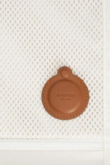 Detail product shot of the Oroton Jet Carry On Roller Case in Warm White and Durable polycarbonate shell for Women .