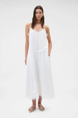 Profile view of model wearing the Oroton Lace Trim Sundress in White and 100% ramie fabric for Women .