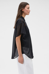 Profile view of model wearing the Oroton Scarf Detail Top in Black and 100% cotton voile fabric for Women .