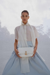 Profile view of model wearing the Oroton Scarf Detail Top in Antique White and 100% cotton voile fabric for Women .
