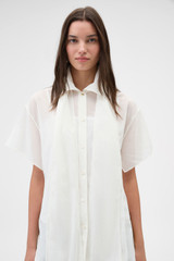Profile view of model wearing the Oroton Scarf Detail Top in Antique White and 100% cotton voile fabric for Women .