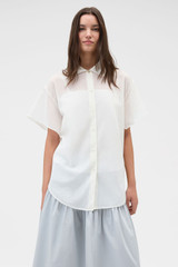 Profile view of model wearing the Oroton Scarf Detail Top in Antique White and 100% cotton voile fabric for Women .