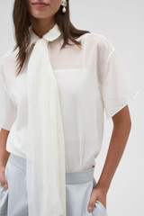 Profile view of model wearing the Oroton Scarf Detail Top in Antique White and 100% cotton voile fabric for Women .