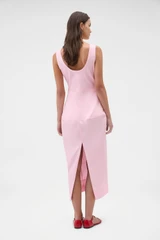 Profile view of model wearing the Oroton Sculpture Tank Dress in Pink Rose and 98% cotton and 2% spandex blend fabric for Women .