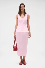Profile view of model wearing the Oroton Sculpture Tank Dress in Pink Rose and 98% cotton and 2% spandex blend fabric for Women .