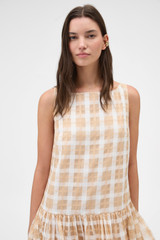 Profile view of model wearing the Oroton Sheer Check Drop Waist Dress in Butterscotch and 80% cotton and 20% lightweight silk blend fabric for Women .