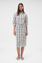 Profile view of model wearing the Oroton Sheer Check Pencil Skirt in Graphite and 80% cotton and 20% lightweight silk blend fabric for Women .