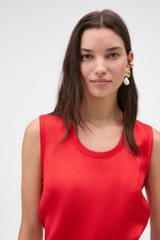 Profile view of model wearing the Oroton Double Satin Tank in Poppy and 100% viscose fabric for Women .
